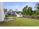 Backyard with a patio, shed, wooden fence, and view of surrounding greenery at 3971 Canebrake Ln, Douglasville, GA 30134