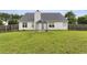 Spacious, green backyard with a patio, fence, and exterior view of the house at 3971 Canebrake Ln, Douglasville, GA 30134