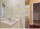 This bathroom features a white sink vanity and an open doorway to the hallway and closet at 3971 Canebrake Ln, Douglasville, GA 30134