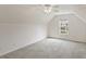This large bedroom features carpeted floors and an ample window at 3971 Canebrake Ln, Douglasville, GA 30134