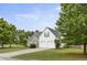 Two-story home featuring a two-car garage and a well-manicured lawn, nestled in a serene neighborhood at 3971 Canebrake Ln, Douglasville, GA 30134