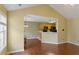 Open-concept living room with hardwood floors connects to a kitchen with black appliances at 3971 Canebrake Ln, Douglasville, GA 30134