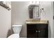 Charming bathroom featuring a granite countertop and a decorative framed mirror at 4108 Berryhill Se Trce, Smyrna, GA 30082