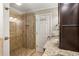 Bathroom with a glass door shower, tile, and granite counters with lots of storage at 4108 Berryhill Se Trce, Smyrna, GA 30082