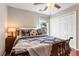 Spare bedroom featuring hardwood floors, a ceiling fan, and a built-in closet at 4108 Berryhill Se Trce, Smyrna, GA 30082