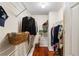 Walk-in closet with shelving, hanging racks, and hardwood floors providing ample storage space at 4108 Berryhill Se Trce, Smyrna, GA 30082