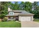 Charming two-story home with well-manicured lawn, a two-car garage, and mature landscaping at 4108 Berryhill Se Trce, Smyrna, GA 30082
