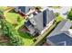 Aerial shot of home with a spacious backyard, deck, manicured lawn, and lush landscaping at 1054 Morgan Garner Sw Dr, Lilburn, GA 30047