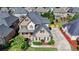 Aerial view of a well-maintained house showcasing its landscaping, driveway, and surrounding neighborhood at 1054 Morgan Garner Sw Dr, Lilburn, GA 30047