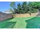 Large backyard with wooden fence at 1054 Morgan Garner Sw Dr, Lilburn, GA 30047