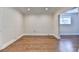 Unfinished basement with hardwood floors and white trim. Great room for storage at 1054 Morgan Garner Sw Dr, Lilburn, GA 30047