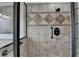 Bathroom showcasing a tiled glass shower with decorative tile accents at 1054 Morgan Garner Sw Dr, Lilburn, GA 30047
