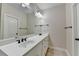 Bathroom featuring a double vanity and tile flooring that combines functionality with cleanliness at 1054 Morgan Garner Sw Dr, Lilburn, GA 30047