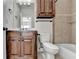Traditional bathroom with wood vanity, tile flooring, and combination tub and shower at 1054 Morgan Garner Sw Dr, Lilburn, GA 30047