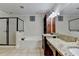 Bathroom featuring a double granite vanity with wood cabinets and a separate tub and shower at 1054 Morgan Garner Sw Dr, Lilburn, GA 30047