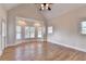 Spacious bedroom features hardwood floors, vaulted ceilings, and a bay window at 1054 Morgan Garner Sw Dr, Lilburn, GA 30047