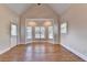 The bright bedroom has hardwood floors, a vaulted ceiling, and large bay windows at 1054 Morgan Garner Sw Dr, Lilburn, GA 30047