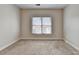 Neutral colored walls and carpet in this bedroom provides a serene and comfortable atmosphere at 1054 Morgan Garner Sw Dr, Lilburn, GA 30047
