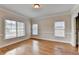 Sun-filled bedroom with hardwood floors and large windows offering plenty of natural light at 1054 Morgan Garner Sw Dr, Lilburn, GA 30047