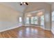 A light-filled bedroom with hardwood floors, vaulted ceilings and a door to the outside at 1054 Morgan Garner Sw Dr, Lilburn, GA 30047