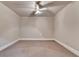 Bedroom with neutral paint, carpet, crown molding, and a ceiling fan at 1054 Morgan Garner Sw Dr, Lilburn, GA 30047