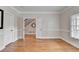 Elegant bedroom with hardwood floors and a view of the staircase at 1054 Morgan Garner Sw Dr, Lilburn, GA 30047