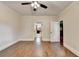Bright bedroom featuring hardwood floors, neutral paint, and a view to the ensuite bathroom at 1054 Morgan Garner Sw Dr, Lilburn, GA 30047