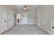 Neutral-toned bedroom with carpet flooring offers a blank slate for design and personalization at 1054 Morgan Garner Sw Dr, Lilburn, GA 30047