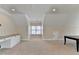 Bonus room with sloped ceilings, built-in desk and ample space at 1054 Morgan Garner Sw Dr, Lilburn, GA 30047