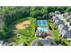 An aerial view of the community tennis courts, pool and clubhouse at 1054 Morgan Garner Sw Dr, Lilburn, GA 30047