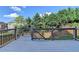 Spacious wooden deck with gray railings overlooking the backyard, perfect for outdoor relaxation at 1054 Morgan Garner Sw Dr, Lilburn, GA 30047