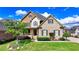 Beautiful two-story home featuring a landscaped yard, brick and stucco accents, and inviting porch at 1054 Morgan Garner Sw Dr, Lilburn, GA 30047