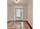 Bright foyer with hardwood flooring and a stylish front door with sidelights and transom window at 1054 Morgan Garner Sw Dr, Lilburn, GA 30047