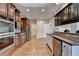 Gourmet kitchen with stainless steel appliances, custom cabinetry and hardwood floors at 1054 Morgan Garner Sw Dr, Lilburn, GA 30047
