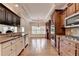 Gourmet kitchen with stainless steel appliances, custom cabinetry, and hardwood floors at 1054 Morgan Garner Sw Dr, Lilburn, GA 30047