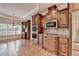 Gourmet kitchen with stainless appliances, custom cabinets, and hardwood floors at 1054 Morgan Garner Sw Dr, Lilburn, GA 30047