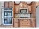 Kitchen features stainless steel appliances, and custom cabinetry at 1054 Morgan Garner Sw Dr, Lilburn, GA 30047