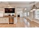 Open-concept kitchen with stainless steel appliances and hardwood floors at 1054 Morgan Garner Sw Dr, Lilburn, GA 30047