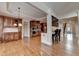 Open concept living space showcasing hardwood floors, eat in kitchen, bar, and staircase at 1054 Morgan Garner Sw Dr, Lilburn, GA 30047