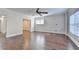 Hardwood floors and natural light fill this open living area with bright windows at 1054 Morgan Garner Sw Dr, Lilburn, GA 30047