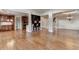Expansive view of the living room showing hardwood floors, coffered ceilings, and an open layout at 1054 Morgan Garner Sw Dr, Lilburn, GA 30047