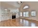 Inviting living room with hardwood floors, lots of natural light, a fireplace and built in storage at 1054 Morgan Garner Sw Dr, Lilburn, GA 30047
