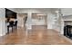 Large open living area featuring hardwood floors, fireplace, built-ins, and views of other rooms at 1054 Morgan Garner Sw Dr, Lilburn, GA 30047