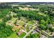 Overview of a community surrounded by mature trees and greenery, showcasing a peaceful neighborhood setting at 150 Wilbanks St, Buford, GA 30518