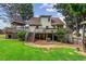 Backyard with a deck, mature trees, and a lawn, providing a private outdoor retreat at 150 Wilbanks St, Buford, GA 30518
