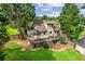 Beautiful backyard featuring a deck with a gazebo, a hot tub, and plenty of space for outdoor activities at 150 Wilbanks St, Buford, GA 30518