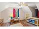 Vintage bedroom with an arm chair, unique wood furniture and hardwood floors at 150 Wilbanks St, Buford, GA 30518
