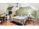 Cozy bedroom with a ceiling fan, desk, and built-in shelves at 150 Wilbanks St, Buford, GA 30518