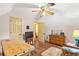 Cozy bedroom features hardwood floors, ample natural light, and neutral tones to make it feel spacious at 150 Wilbanks St, Buford, GA 30518