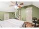 Charming bedroom with a ceiling fan, desk, and ample closet space at 150 Wilbanks St, Buford, GA 30518